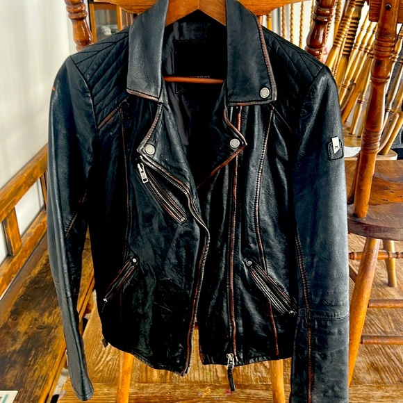 Unique brown leather jacket purchased at a boutique in PEC. - Picture 1 of 3